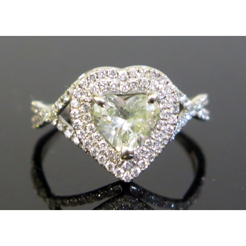 180 - A Modern Heart Shaped Diamond Ring in a precious white metal setting, central stone c. 1.5ct, 13x12.... 