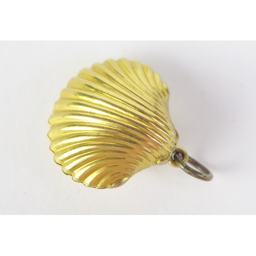 181 - **WITHDRAWN _ Late payment from previous sale** A 9ct Gold Scallop Shaped Locket, stamped 9CT, 22mm ... 