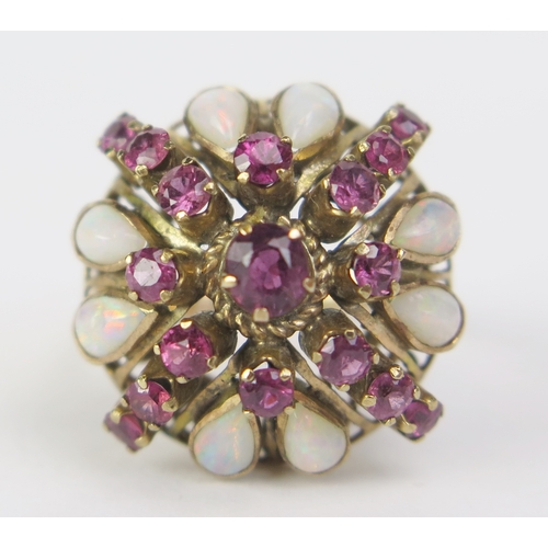 182 - A 14K Gold, Opal and Red Stone Cluster Ring, 22mm head, size L.5, stamped 14K (tests as rubies), 4.9... 