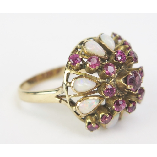 182 - A 14K Gold, Opal and Red Stone Cluster Ring, 22mm head, size L.5, stamped 14K (tests as rubies), 4.9... 