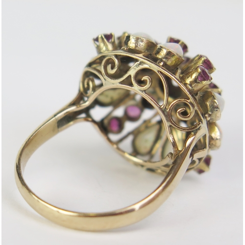 182 - A 14K Gold, Opal and Red Stone Cluster Ring, 22mm head, size L.5, stamped 14K (tests as rubies), 4.9... 