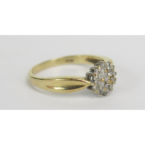 188 - A 9ct Gold and Diamond Cluster Ring, 8mm wide head, size M.5, hallmarked, 2.35g