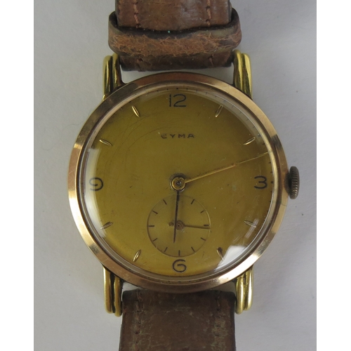 403 - A CYMA 18ct Gold Gent's Wristwatch, 33.5mm case no. 1407 88308, 15 jewel movement no. 136681. Winds ... 