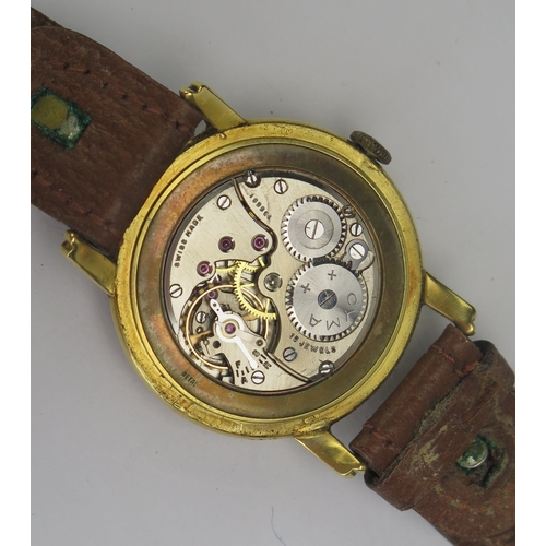 403 - A CYMA 18ct Gold Gent's Wristwatch, 33.5mm case no. 1407 88308, 15 jewel movement no. 136681. Winds ... 