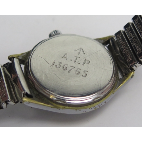 413 - A WWII TIMOR 'One of the Dirty Dozen' Wristwatch, 31mm case back marked A.T.P. 136765. Needs attenti... 