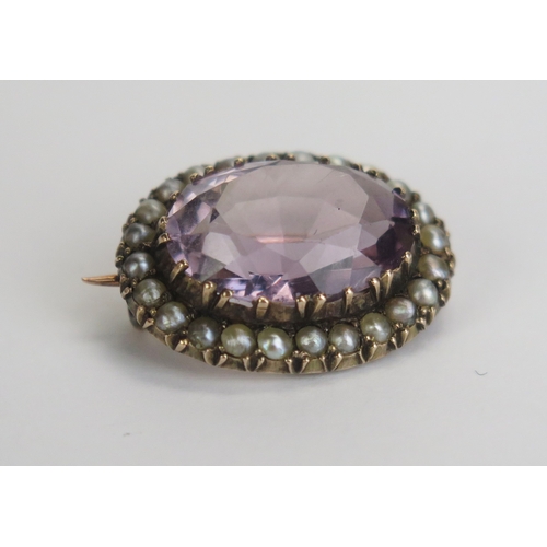 5 - An Amethyst and untested Pearl Brooch in a precious yellow metal setting, 21.5x17mm, KEE tested as 9... 