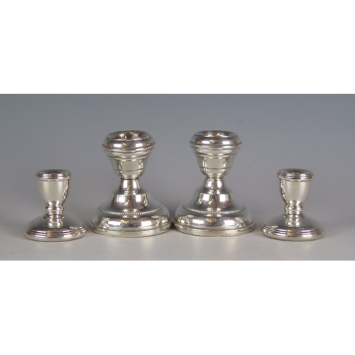 513 - A pair of George V silver candlesticks, maker Marson & Jones, Birmingham 1932, of plain circular for... 