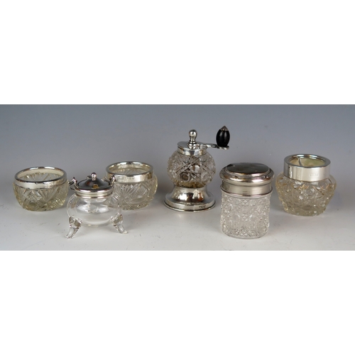 527 - A clear glass and silver mounted pepper mill of thistle-shaped outline, together with assorted clear... 