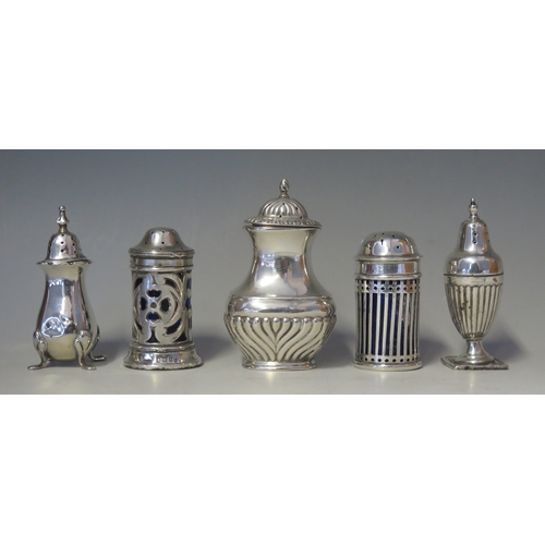 533 - A mixed collection of five silver pepperettes, various makers and dates, weighable silver 135gms, 4.... 