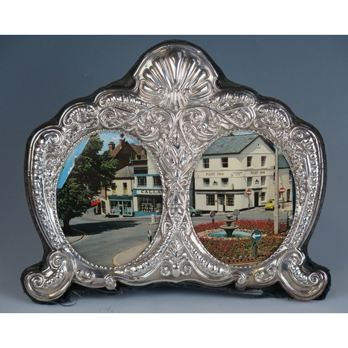 571 - An Elizabeth II silver double photograph frame, maker Carrs of Sheffield, 1996, 15 x 18cm.