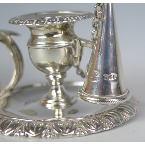 596 - A Victorian silver chamberstick, maker George Gilliam, London, 1890, with urn-shaped sconce on a cir... 