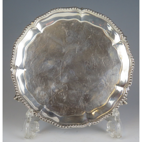 603 - A Victorian silver waiter, maker Henry Wilkinson & Co, London, 1892, with beaded border, raised on t... 