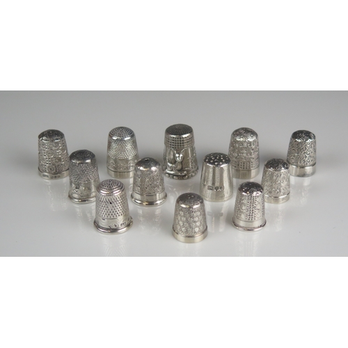 606 - A mixed collection of twelve assorted silver thimbles, various makers and dates, 52gms, 1.69ozs