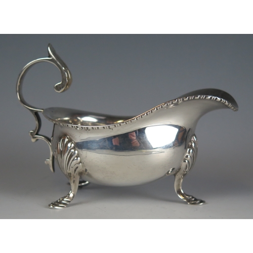 625 - A George V silver sauce boat, maker William Neale & Son Ltd, Birmingham, 1924, of traditional design... 