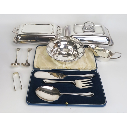 628 - A collection of plated wares including entree dishes and covers, sauce boat, serving spoons etc.