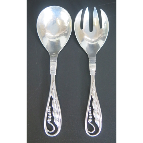 644 - A pair of Georg Jensen silver pattern 42 serving spoons, bears import marks, 15cm long, 74.4gms, 2.3... 