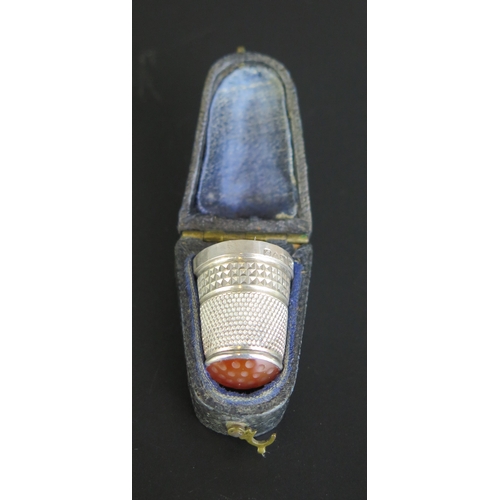 666 - An Edward VII silver and agate thimble, maker Charles Horner, Chester, 1907, contained in a leather ... 