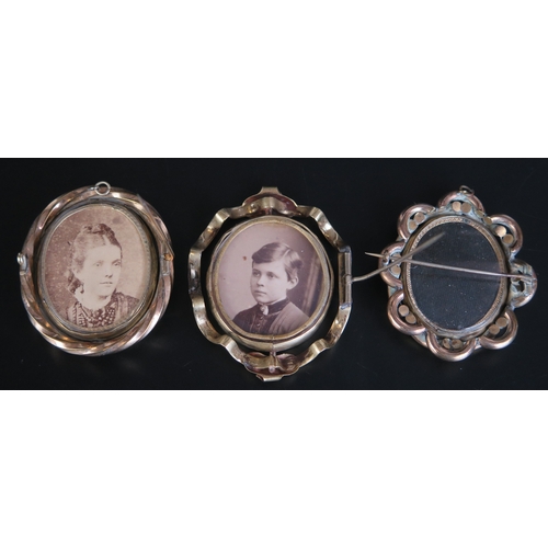 667 - Three gilt metal swivel brooches of oval outline, with photographs to either sides.