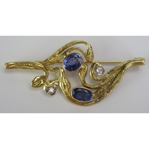 67 - A Modern 18ct Gold, Diamond and Blue Stone Foliate Brooch, 55.1mm wide, London 1984, maker AMB, 9.81... 