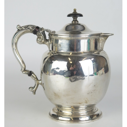 677 - An Edward VII silver lidded jug, maker, Fordham & Faulkner, Sheffield, 1903, of bulbous ovoid outlin... 