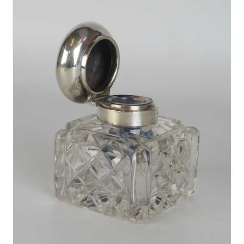 686 - An Edward VII clear glass and silver mounted ink well, with domed hinged lid, monogrammed,