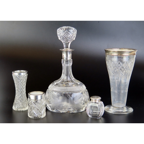 689 - A collection of clear glass and silver mounted wares including small decanter.