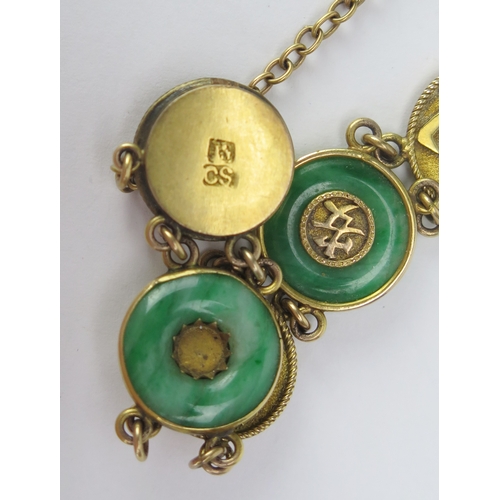 69 - A Chinese Gold and Jadeite Panel Bracelet decorated with Chinese characters, 15.1mm diam. panels, cl... 