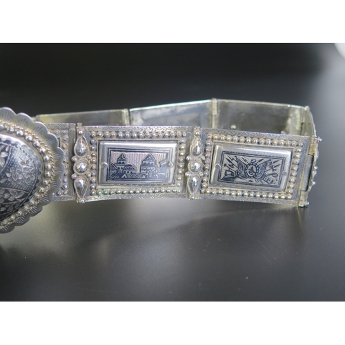 692 - A late 19th century Eastern silver and niello decorated belt, with oval domed shaped clasp with rect... 