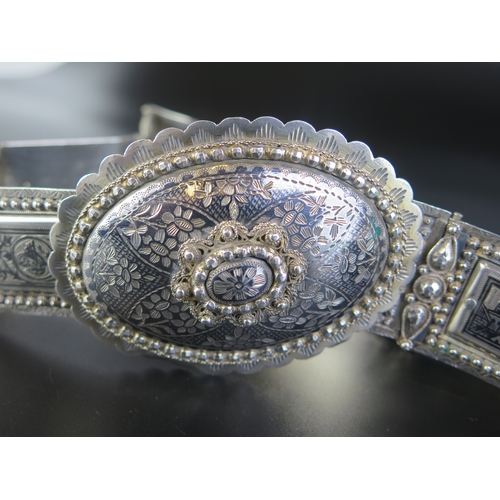 692 - A late 19th century Eastern silver and niello decorated belt, with oval domed shaped clasp with rect... 