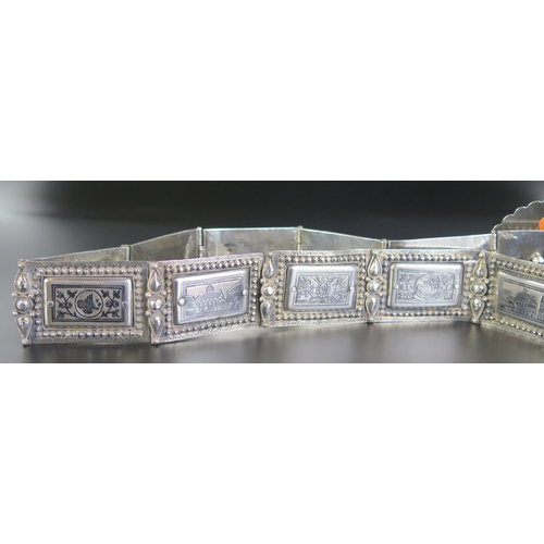 692 - A late 19th century Eastern silver and niello decorated belt, with oval domed shaped clasp with rect... 