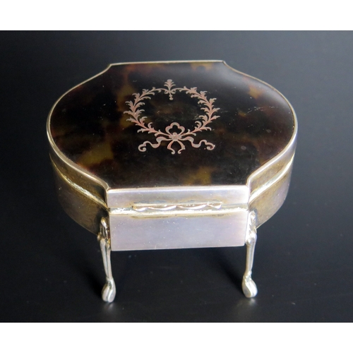 699 - A sterling silver and tortoiseshell jewellery casket, of cartouche-shaped outline, raised on four sl... 