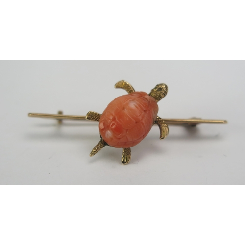 70 - An Antique Carved Coral Turtle Brooch in a precious yellow metal mount, 38.7mm wide, KEE tested as 9... 