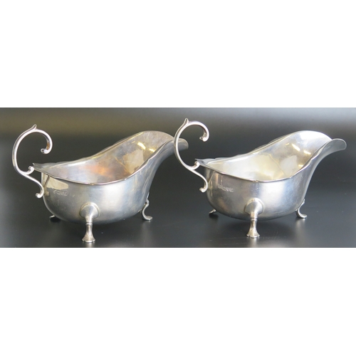 702 - A pair of George V silver  sauce boats, maker Barker Brothers, Chester, 1918, of traditional design ... 