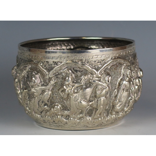 713 - A Burmese silver bowl, with embossed figural decoration to the sides, 13cm diameter, 221gms, 7.13ozs