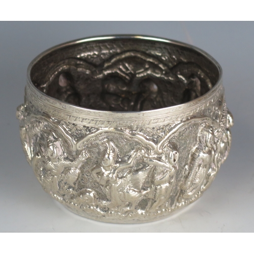 713 - A Burmese silver bowl, with embossed figural decoration to the sides, 13cm diameter, 221gms, 7.13ozs