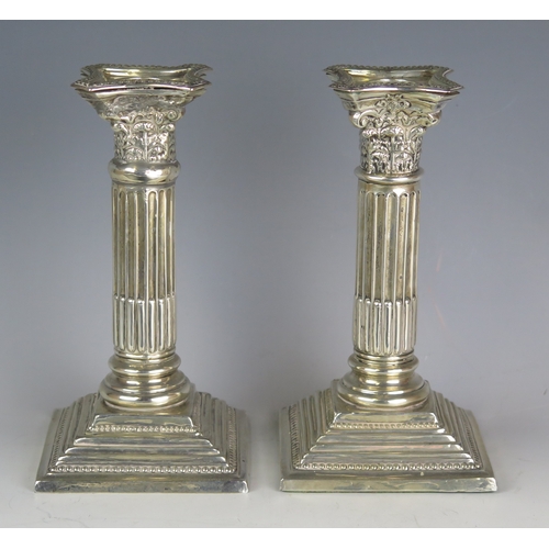 723 - A pair of Edward VII silver Corinthian candlesticks, maker George Nathan & Ridley Hayes, Chester 190... 