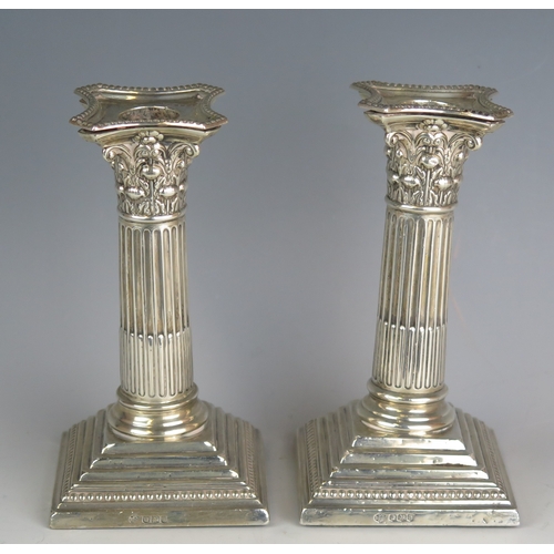 724 - A pair of George V silver Corinthian candlesticks, maker William Hutton & Sons Ltd, Sheffield, 1925,... 