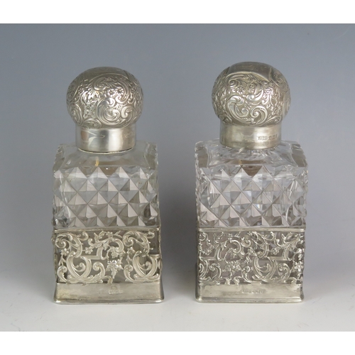 727 - A pair of Victorian clear glass and silver mounted scent bottles, maker James Dixon & Sons Ltd, Shef... 