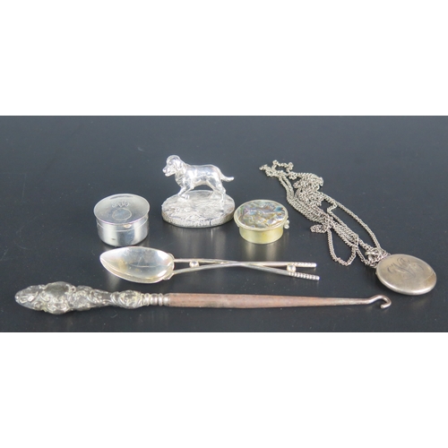 735 - A collection of mixed silver wares including dog model, locket, golfing spoon,