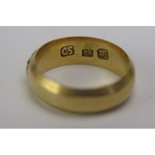 77 - A Chinese 20ct Gold Band decorated with three characters, marked CS 20 and with a Chinese character ... 