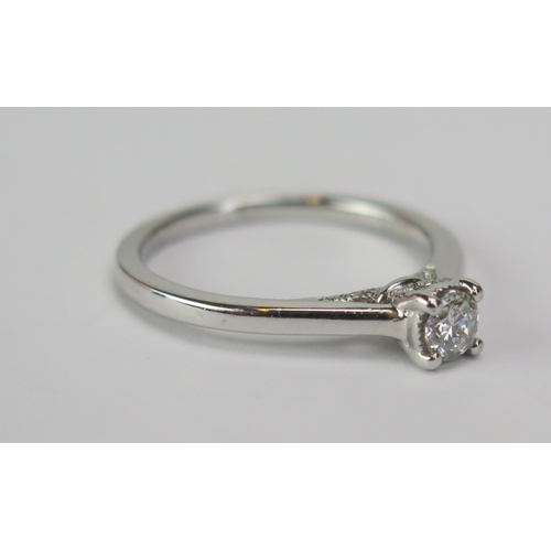 78 - A Jenny Packham 18ct White Gold and Diamond Solitaire Ring, .33ct, size M.5, Birmingham hallmarks, 3... 