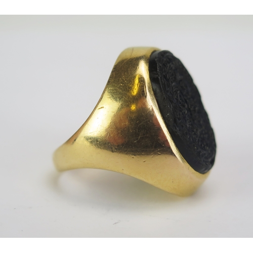 81 - An Antique Ottoman? 18ct Gold and Hardstone Seal Ring, the opaque black stone c. 19.5x13.2mm matrix ... 