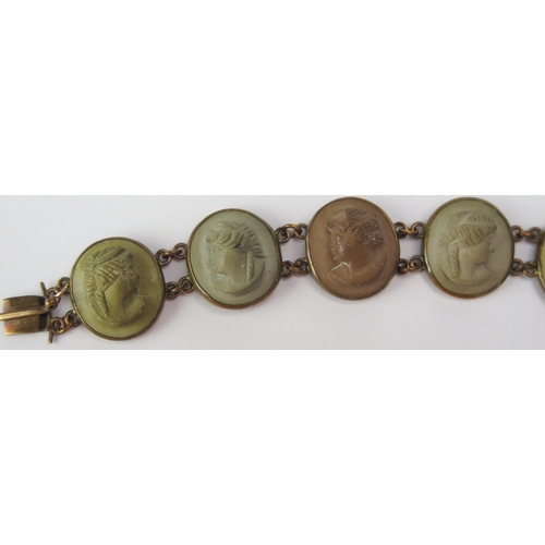 89 - A 19th Century Lava Cameo Panel Bracelet decorated with ten female busts in profile in a yellow meta... 