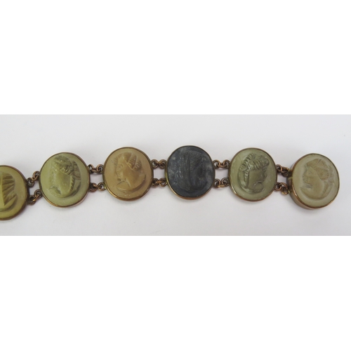 89 - A 19th Century Lava Cameo Panel Bracelet decorated with ten female busts in profile in a yellow meta... 