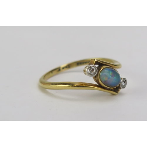 94 - An 18ct Gold and Platinum, Black Opal and Diamond Crossover Ring, 6.2x4.2mm millegrain set singlet f... 