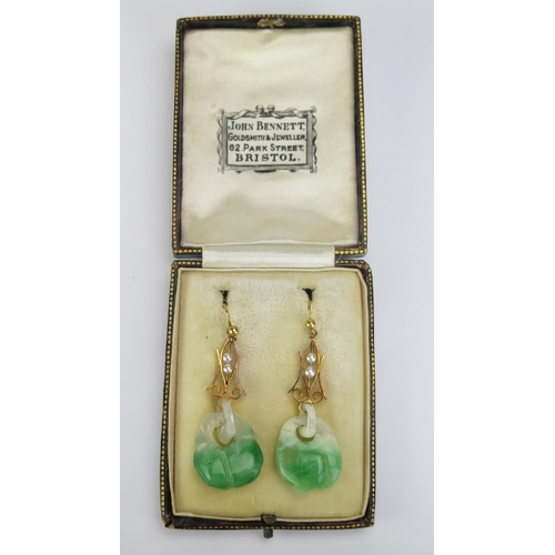 95 - A Pair of 18ct Gold and Carved Jade Pendant Earrings with sliding untested pearls to the suspensions... 