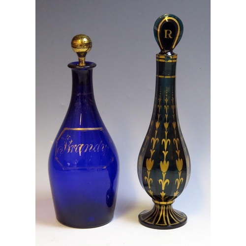 1003 - A 19th century blue glass brandy decanter and stopper, of ovoid form with gilt decoration, 22cm high... 