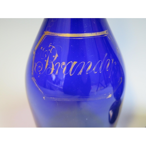 1003 - A 19th century blue glass brandy decanter and stopper, of ovoid form with gilt decoration, 22cm high... 