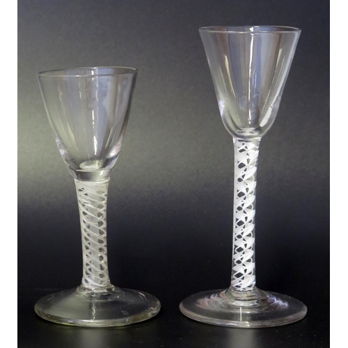 1004 - A 19th century wine glass with inverted bell-shaped bowl on an opaque twist stem and circular spread... 