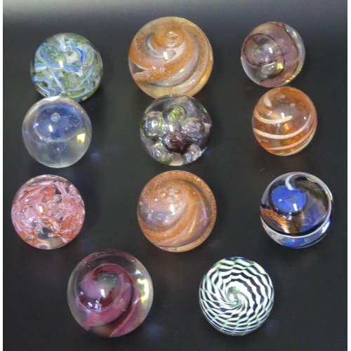 1014 - A collection of eleven assorted glass paperweights, by various manufacturers, some boxed.